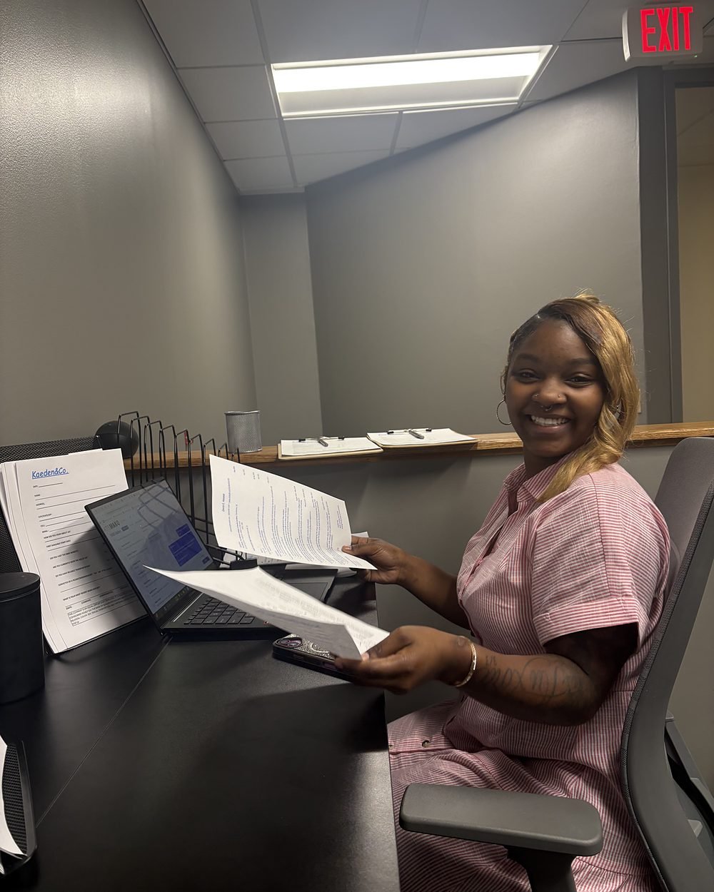 A member of the Kaeden & Co. team at her desk in the office